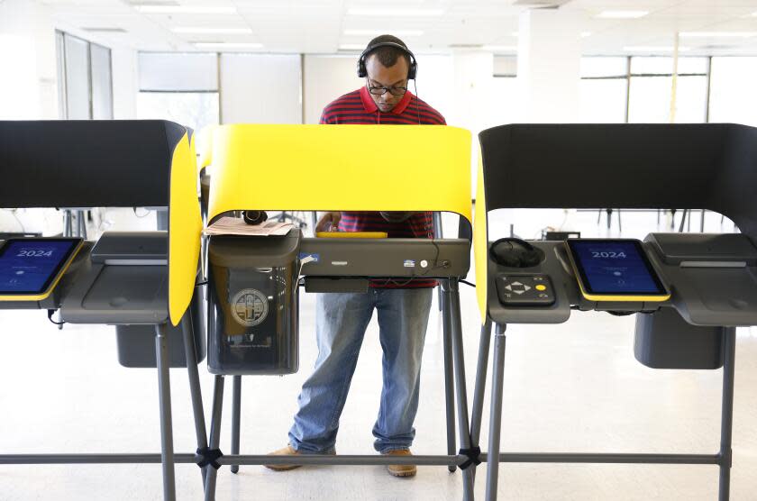 NORWALK-CA-MARCH 4, 2024: Josiah Burnley, 20, of Los Angeles votes for the first time in the presidential primary election at the Los Angeles County Registrar Recorder in Norwalk on March 4, 2024. (Christina House / Los Angeles Times)