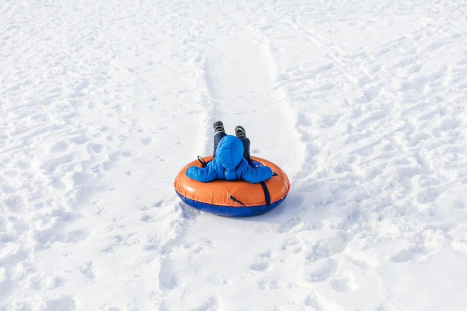 42) Go snow tubing or sledding.