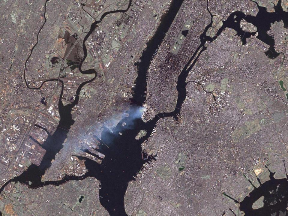 The smoke from the wreckage of the Twin Towers as viewed from space (Nasa)