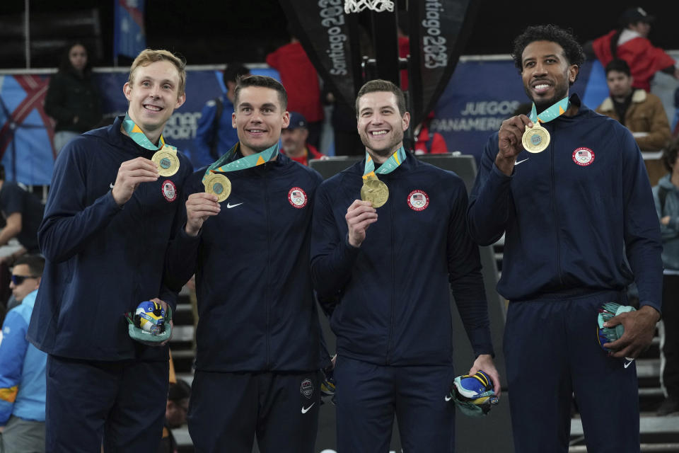 The United States team celebrates with their gold medals on the podium of the men's 3x3 basketball at the Pan American Games in Santiago, Chile, Monday, Oct. 23, 2023. (AP Photo/Dolores Ochoa)