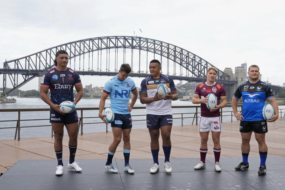Team captains, Rob Leota, Melbourne Rebels, from left, Jake Gordon, NSW Waratahs, Alan Alaalatoa, ACT Brumbies, Tate McDermott, QLD Reds, and Tom Robertson, Western Force, pose for a photo during the launch of the 2023 season of the Super Rugby Pacific competition in Sydney, Wednesday, Feb. 15, 2023. (AP Photo/Rick Rycroft)