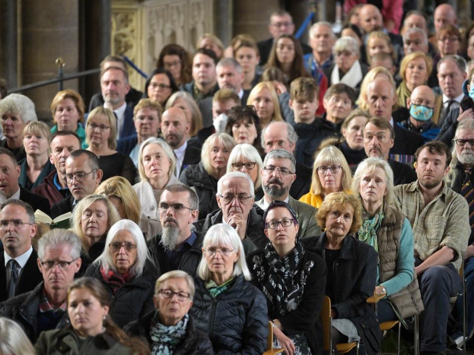 People gather at Salisbury Cathedral to watch Queen Elizabeth II's funeral in Salisbury, England.