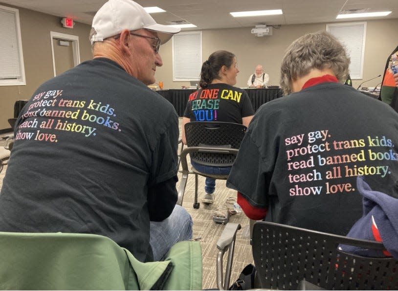 Michael and Linda Wagner of Galena wear shirts supporting the LGBTQIA + community as the Big Walnut Local School District school board discussed a resolution Thursday night that would prohibit gay pride flags.