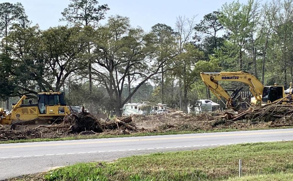 Heavy equipment clears trees to allow for construction of another two lanes of Highway 57 near The Shed restaurant. An RV park adjacent to the Shed was reduced in size to accommodate the new highway leading to Vancleave.