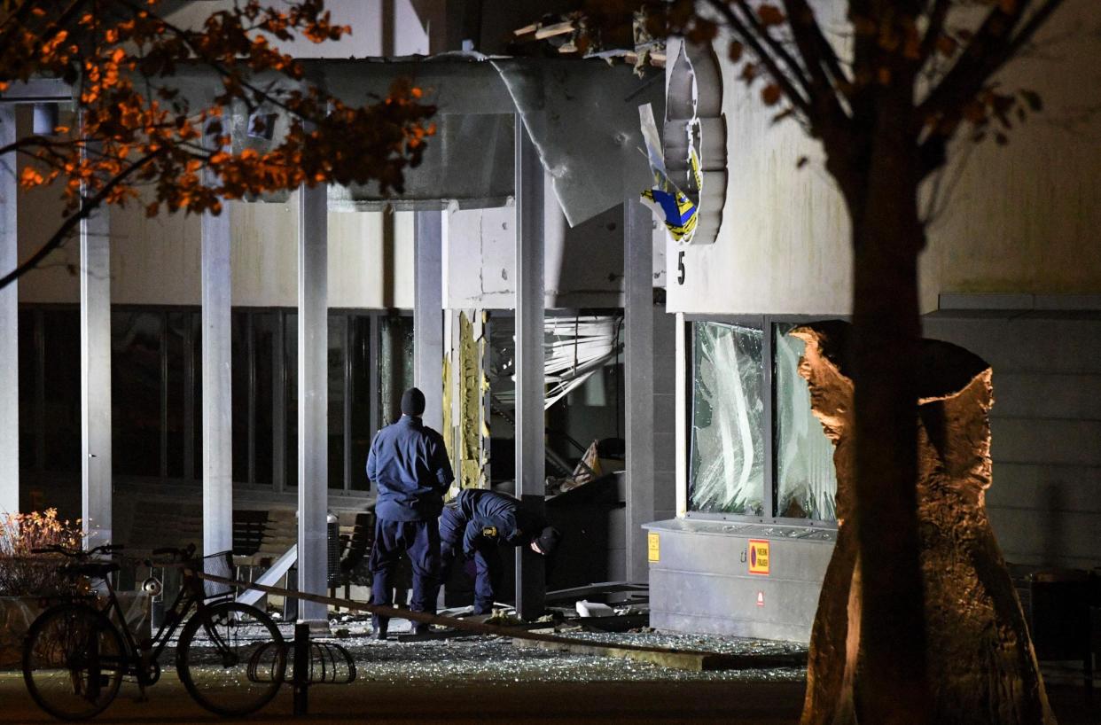 Police forensics officers outside the police station in Helsingborg after a powerful explosion at the main entrance: AFP/Getty Images