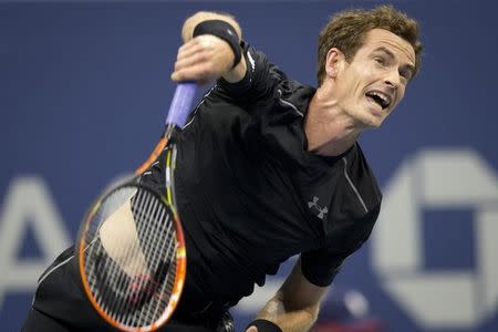 Andy Murray of Britain serves to Nick Kyrgios of Australia during their first round match at the U.S. Open Championships tennis tournament in New York, August 31, 2015. REUTERS/Carlo Allegri