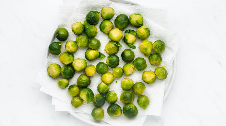 Boiled sprouts drying on plate