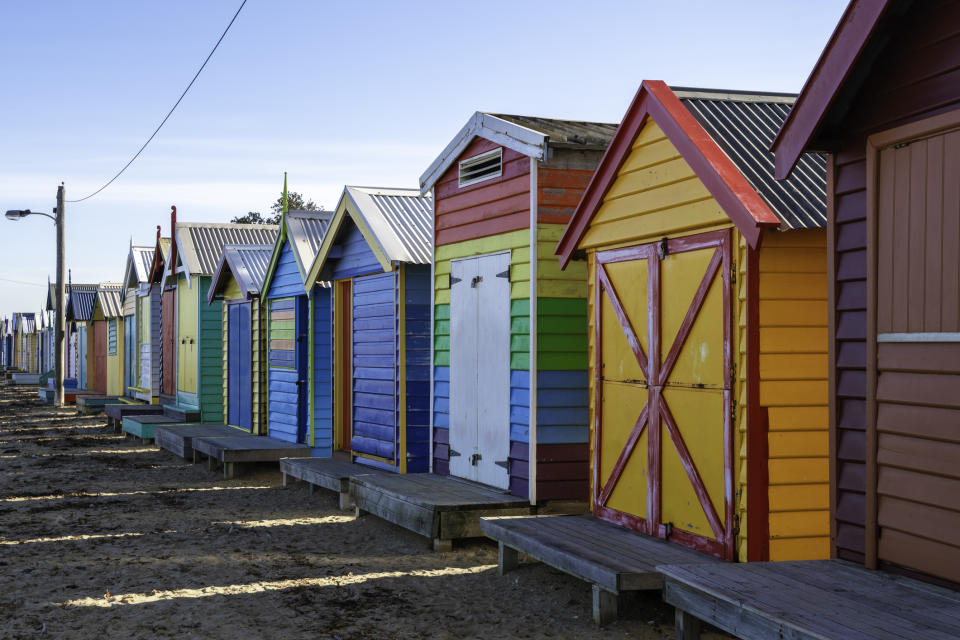 Bright and colourful bathing huts at Brighton Beach on the outskirts of Melbourne, Australia