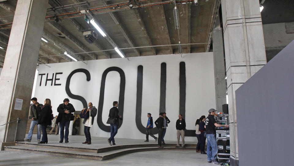 Members of the media are gathered in the lobby of the Palais de Tokyo in Paris, Thursday, April 12, 2012. After six months of works, this museum devoted to contemporary art will reopen to the public on April 20. (AP Photo/Remy de la Mauviniere)