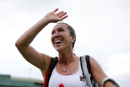 Jelena Jankovic of Serbia celebrates after winning her match against Evgeniya Rodina of Russia at the Wimbledon Tennis Championships in London, July 2, 2015. REUTERS/Suzanne Plunkett