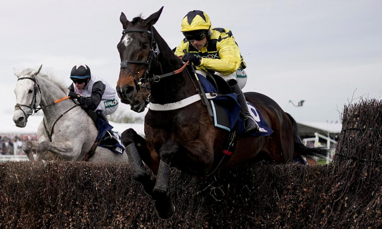 <span>Nico de Boinville rides Shishkin (yellow) at Aintree’s Grand National meeting last month.</span><span>Photograph: Alan Crowhurst/Getty Images</span>