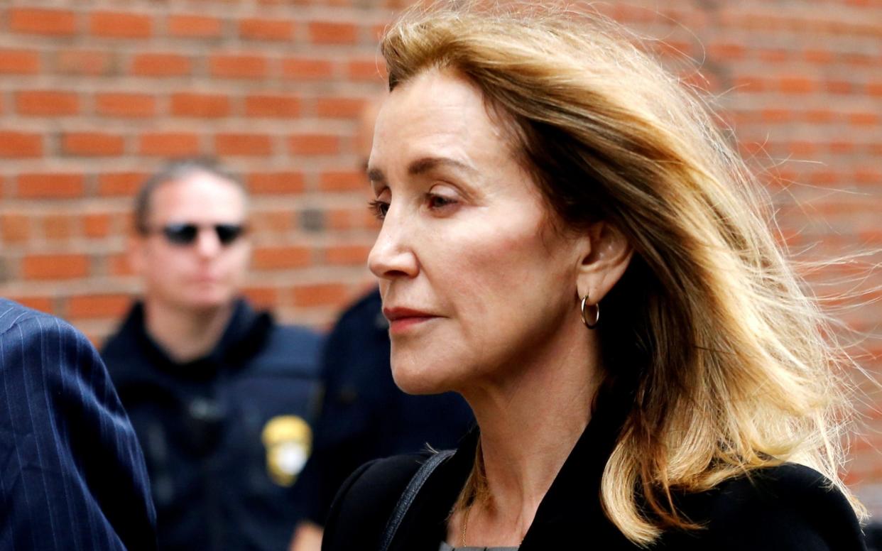 Actor Felicity Huffman said it was to her 'eternal shame' that she did not pull out of the scheme  - REUTERS