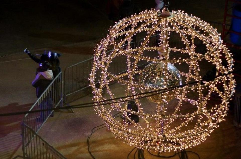 People take selfies Dec. 31, 2018, in front of the ball at Opening Night 2019 in Bicentennial Park in downtown Oklahoma City.