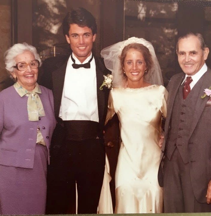 Marta Prietto O'Hara with her grandma&nbsp;Maria Teresa (a.k.a Grande) and grandpa Manuel Moreno. In addition to the wedding dress, Grande (left) made the suit and blouse she is wearing in this photo. (Photo: Courtesy of Marta Prietto O'Hara)