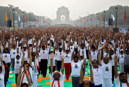 People perform yoga at India Gate on International Yoga Day in New Delhi, India, June 21, 2018. REUTERS/Saumya Khandelwal