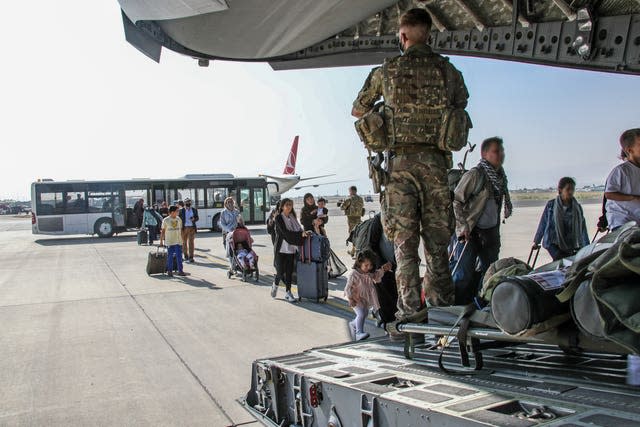 British citizens and dual nationals get on an RAF plane in Afghanistan