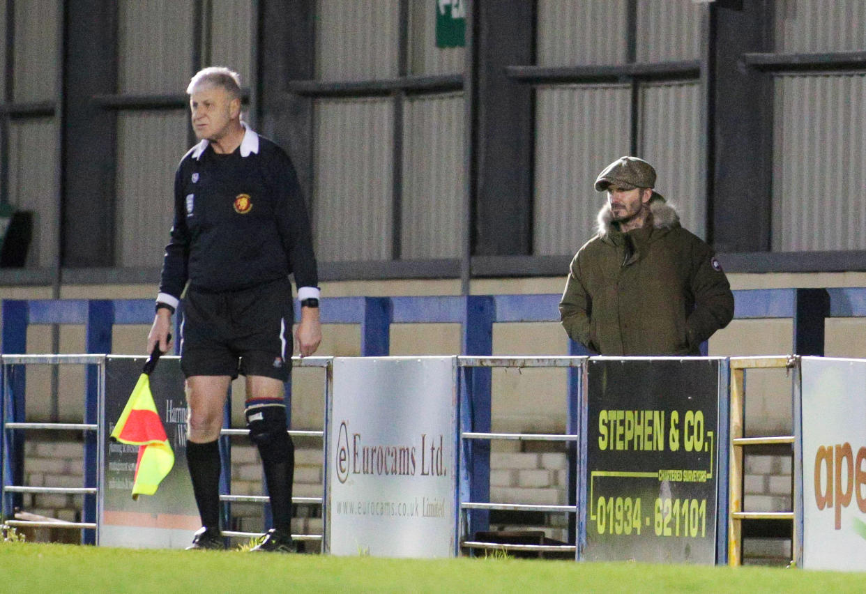 Clad in a Canada Goose coat, jeans and baker boy hat, the 44-year-old made his way around the ground to get the best view of the action after paying £3 to get in. (Jon Mills / SWNS)