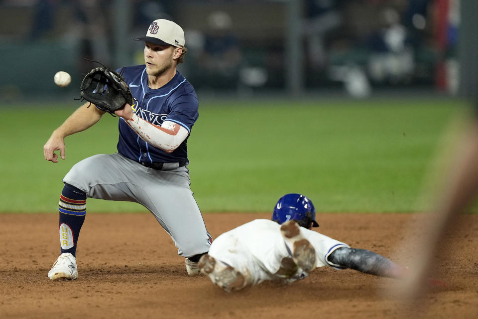 Kansas City Royals' Bobby Witt Jr. is caught stealing second by Tampa Bay Rays shortstop Taylor Walls during the sixth inning of a baseball game Thursday, July 4, 2024, in Kansas City, Mo. (AP Photo/Charlie Riedel)