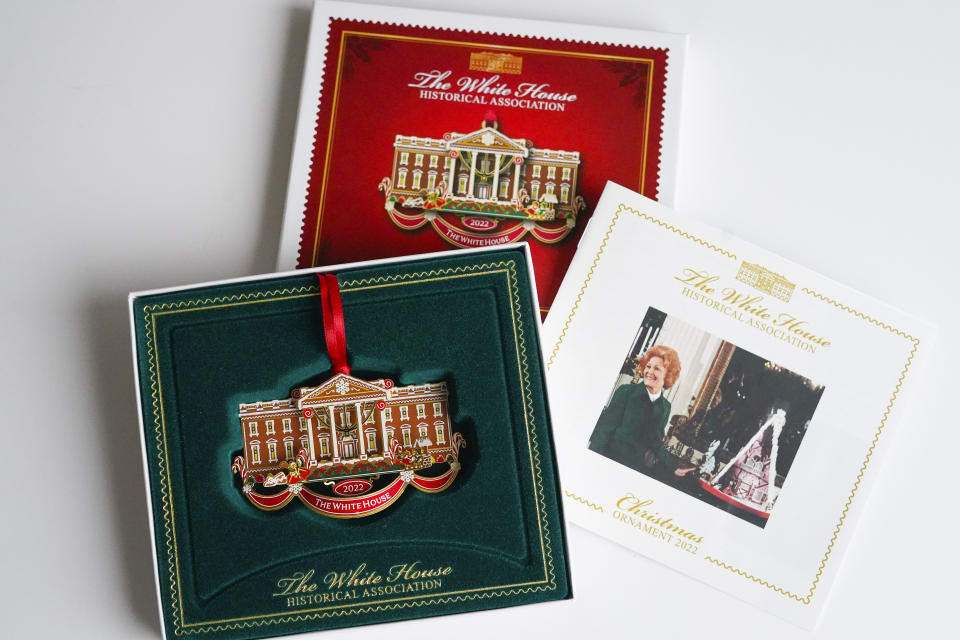 The White House Historical Association's 2022 Christmas Ornament, Tuesday, Dec 6, 2022 in Washington. The annual tree ornament is honors President Richard M. Nixon's administration and a nod to first lady Pat Nixon who first put a gingerbread house on display in the State Dining Room for the holiday season at the White House, long before its talented pastry chefs began making hundred-pound replicas of the executive mansion. (AP Photo/Pablo Martinez Monsivais)