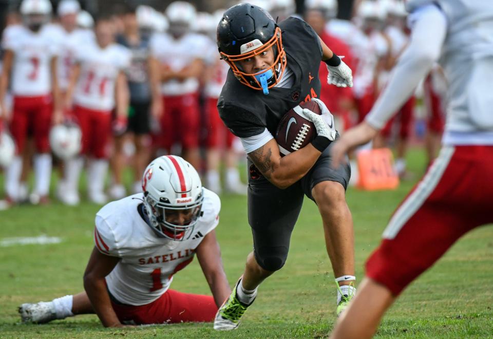 Jayvan Boggs of Cocoa tries to maneuver through the Satellite defense in the 2023 season opening football kickoff classic Thursday, August 17, 2023. Craig Bailey/FLORIDA TODAY via USA TODAY NETWORK