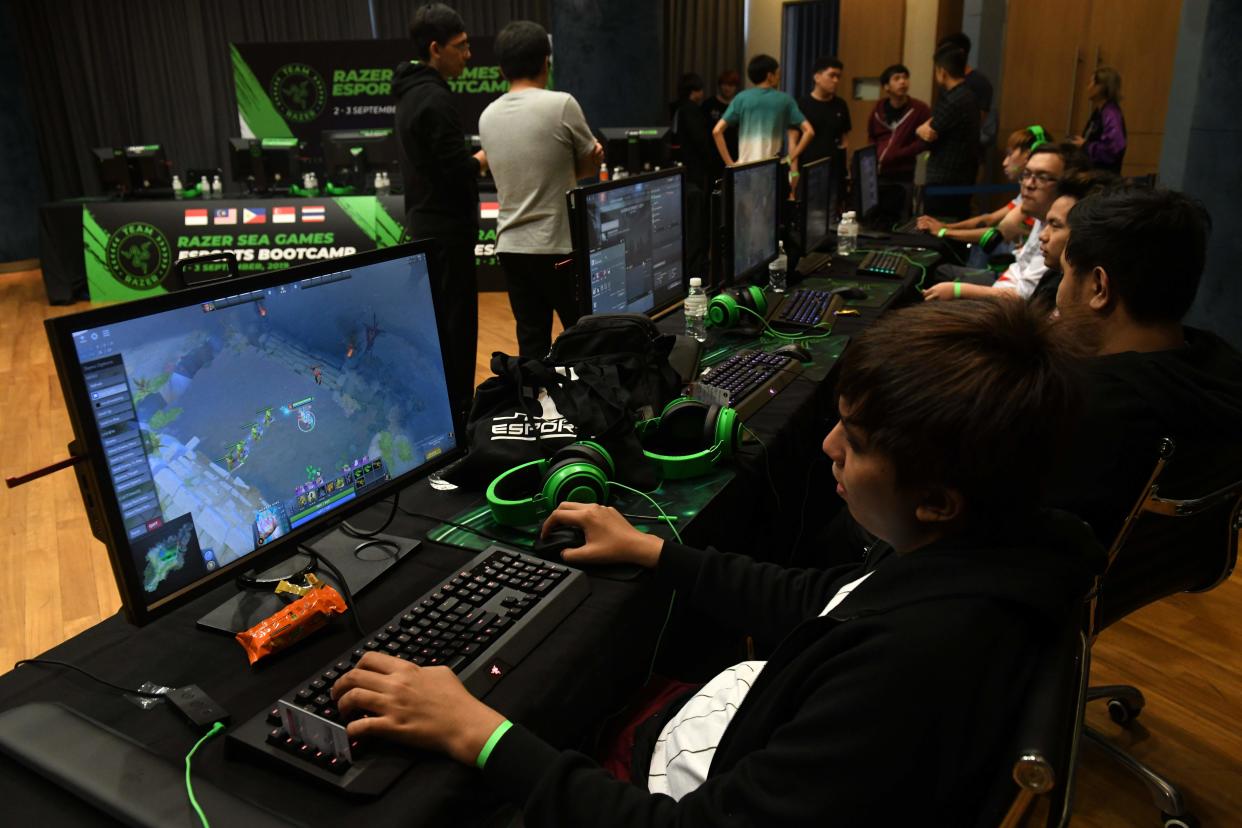 This photograph taken on September 2, 2019 shows participants attending an Esports bootcamp training session in Singapore. - Teenage gamers worldwide are shunning mainstream education in favour of spending hours tapping away on computers and phones, attracted by a booming eSports scene where prizes at major tournaments reach millions of dollars. - TO GO WITH Singapore-eSports-SEAGames,FEATURE by Martin Abbugao and Sam Reeves (Photo by ROSLAN RAHMAN / AFP) / TO GO WITH Singapore-eSports-SEAGames,FEATURE by Martin Abbugao and Sam Reeves (Photo by ROSLAN RAHMAN/AFP via Getty Images)