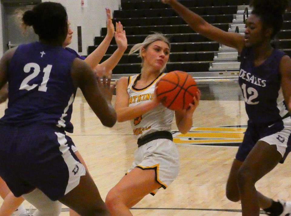 Watkins Memorial junior Kalleigh Rennie turns in the paint and looks to the corner for an open teammate against DeSales on Saturday, Jan. 22, 2022. Rennie helped the host Warriors rally for a 35-33 victory.