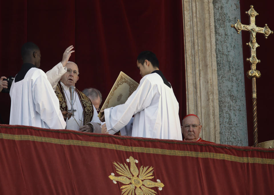 Pope Francis delivers the Urbi et Orbi (Latin for 'to the city and to the world' ) Christmas' day blessing from the main balcony of St. Peter's Basilica at the Vatican, Tuesday, Dec. 25, 2018. (AP Photo/Alessandra Tarantino)