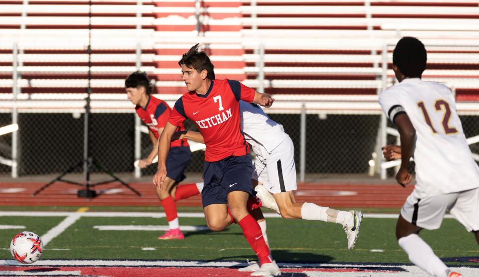 Ketcham's Dominic Abbatiello drives up field against Arlington during an Oct. 11, 2023 boys soccer match.