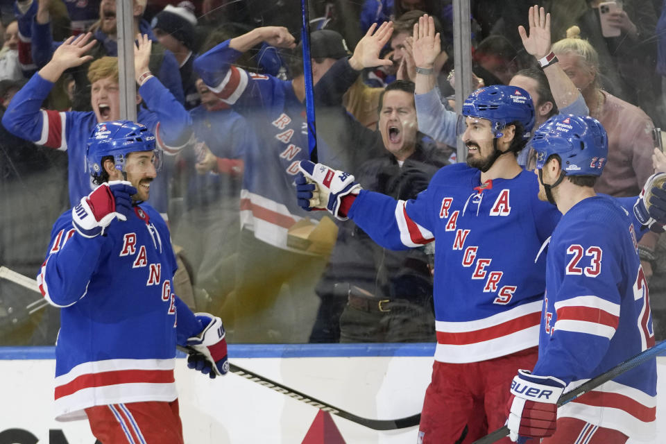 New York Rangers left wing Chris Kreider, center, celebrates after scoring against the Montreal Canadiens during the third period of an NHL hockey game, Sunday, April 7, 2024, at Madison Square Garden in New York. (AP Photo/Mary Altaffer)