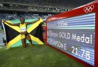 2016 Rio Olympics - Athletics - Final - Women's 200m Final - Olympic Stadium - Rio de Janeiro, Brazil - 17/08/2016. Elaine Thompson (JAM) of Jamaica celebrates after winning gold. REUTERS/Kai Pfaffenbach