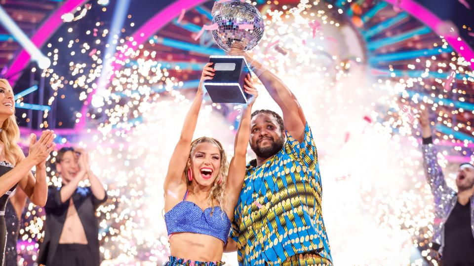 Hamza Yassin and Jowita Przystal lifting the glitterball trophy in the Strictly Come Dancing final 2022