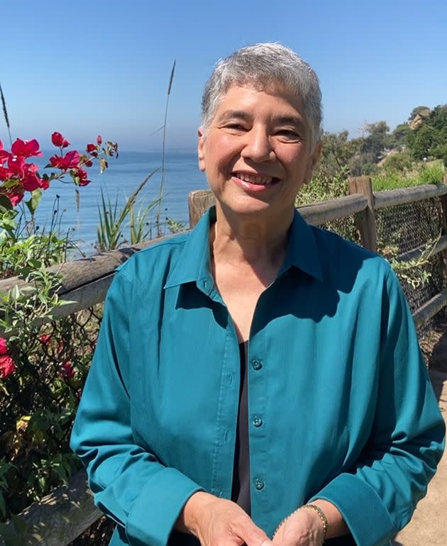 The author is shown at a beach in California, where she lives.