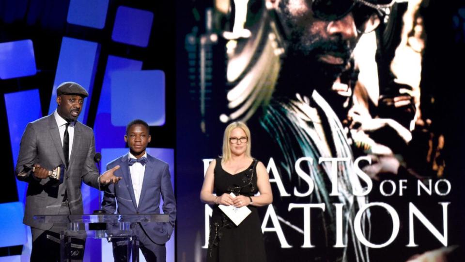 Actor Idris Elba (L) accepts the Best Supporting Male award for 'Beasts of No Nation' with actor Abraham Attah (C) and actress Patricia Arquette (R) onstage during the 2016 Film Independent Spirit Awards on February 27, 2016 in Santa Monica, California. (Photo by Kevork Djansezian/Getty Images)
