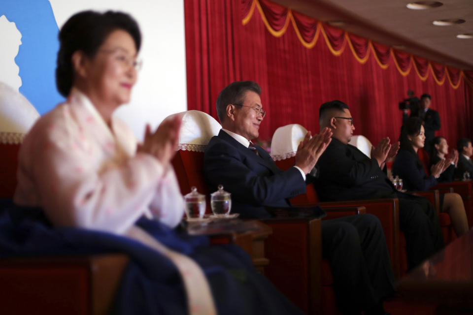 South Korean President Moon Jae-in, second from left, his wife Kim Jung-sook, left, North Korean leader Kim Jong Un and his wife Ri Sol Ju, right, watch an art performance at Pyongyang Grand Theatre in Pyongyang, North Korea, Tuesday, Sept. 18, 2018. President Moon Jae-in began his third summit with North Korean leader Kim Jong Un on Tuesday with possibly his hardest mission to date — brokering some kind of compromise to keep North Korea's talks with Washington from imploding and pushing ahead with his own plans to expand economic cooperation and bring a stable peace to the Korean Peninsula. (Pyongyang Press Corps Pool via AP)