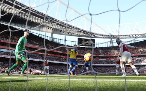 Lacazette diverts the ball home for 1-0 - Credit: GETTY IMAGES