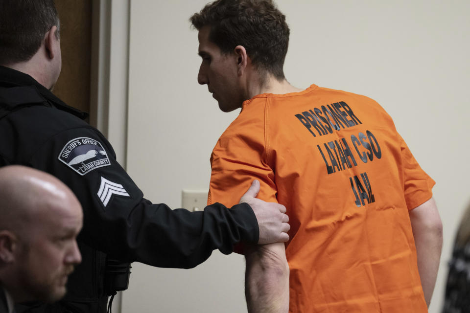 Bryan Kohberger, right, who is accused of killing four University of Idaho students in November 2022, is led away following a hearing in Latah County District Court, Thursday, Jan. 5, 2023, in Moscow, Idaho. (AP Photo/Ted S. Warren, Pool)