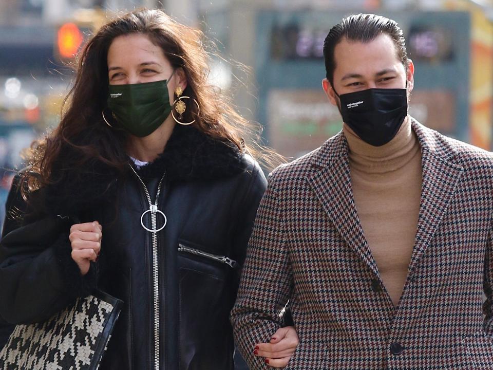 Katie Holmes and Emilio Vitolo walking arm-in-arm in New York City in February 2021.