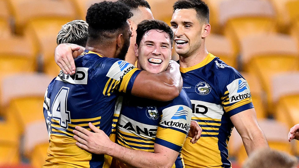 Waqa Blake and Mitchell Moses, pictured here celebrating as the Eels thrash the Broncos in the NRL.