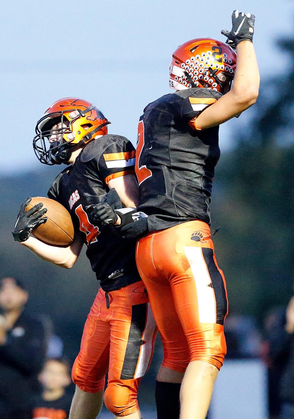 Lucas High School's Zach Diehl (4) celebrates with Logan Toms (2) after his touchdown against Plymouth High School during high school football action at Lucas High School Friday, Oct. 6, 2023. TOM E. PUSKAR