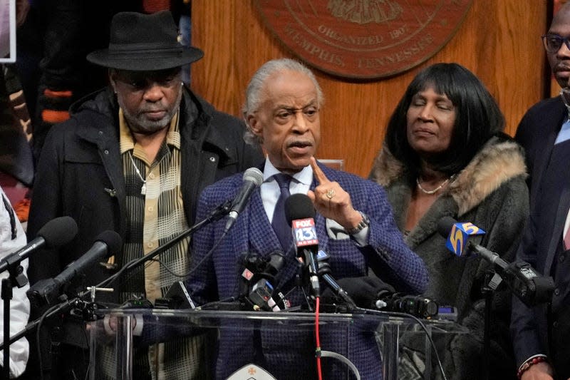 The Rev. Al Sharpton speaks at historic Mason Temple as he is flanked by RowVaughn Wells, right, mother of Tyre Nichols, and Tyre’s stepfather Rodney Wells, left, during a news conference about the death of Tyre Nichols, Tuesday, Jan. 31, 2023, in Memphis, Tenn.