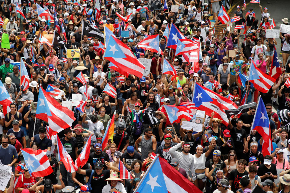 IMAGE: Rally celebrate Ricardo Rossello's resignation (Marco Bello / Reuters file)