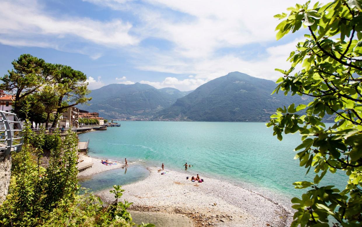 People at the beach at Lake Iseo - Getty