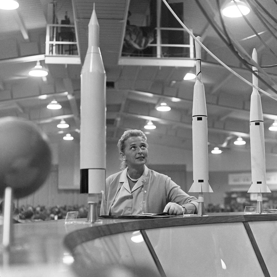 FILE - This May 26, 1961 file photo shows Jerrie Cobb, the nation's first female astronaut candidate, with a display of rockets at a national conference where the leading space experts gathered in Tulsa, Okla. Cobb died in Florida at the age of 88 on March 18, 2019. (AP Photo/William P. Straeter)