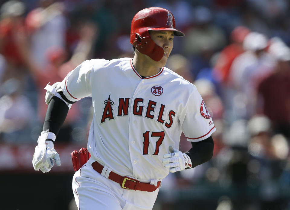 Los Angeles Angels designated hitter Shohei Ohtani rounds first after hitting a two-run home run against the Chicago White Sox during the seventh inning of a baseball game in Anaheim, Calif., Sunday, Aug. 18, 2019. (AP Photo/Alex Gallardo)