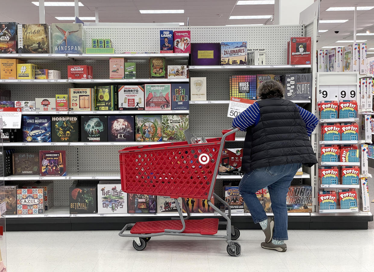 A Target customer looks at a display of board games while shopping at Target store on December 15, 2022 in San Francisco, California. (Photo by Justin Sullivan/Getty Images)