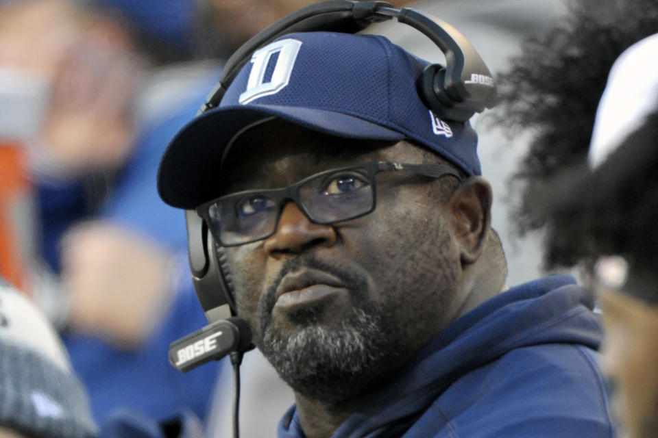 FILE - Then-Dallas Cowboys running backs coach Gary Brown looks at the score board during an NFL football game against the Washington Redskins in Landover, Md., in this Sunday, Oct. 21, 2018, file photo. Wisconsin’s run-oriented tradition coaxed former NFL assistant Gary Brown into the college ranks after a bout with cancer caused him to spend a year away from the game. The Badgers’ new running backs coach wants to get Wisconsin back among the nation’s elite rushing attacks as he mentors a group returning Jalen Berger and adding Clemson transfer Chez Mellusi and freshman Braelon Allen. (AP Photo/Mark Tenally, File)