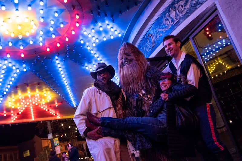 Fans arrive at the Grand Lake Theater for the opening of the final chapter of the Skywalker saga 'Star Wars: The Rise of Skywalker' in Oakland