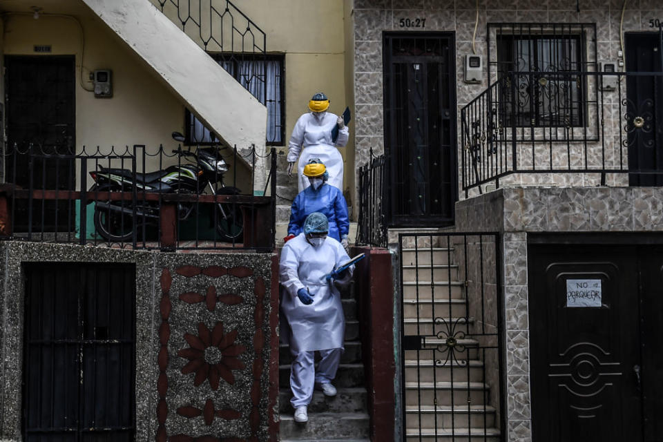 Covid cleaners in Medellin - getty