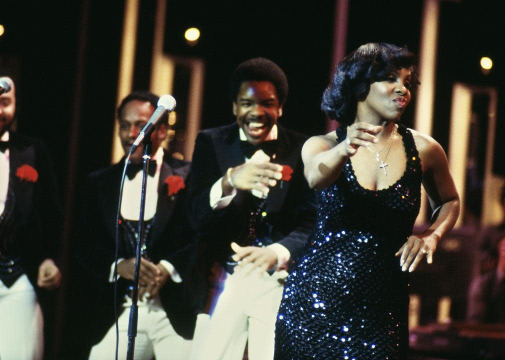 Gladys Knight performing on stage with the Pips.