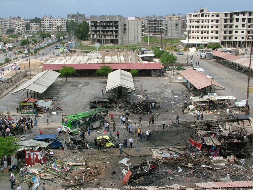 People inspect the damage after explosions hit the Syrian city of Tartus on May 23, 2016. (SANA via Reuters)